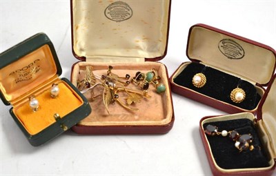Lot 153 - A pair of cultured pearl screw-on earrings, a pair of leaf motif garnet set earrings stamped '9CT'