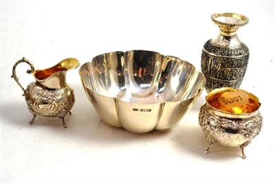 Lot 166 - A silver lobed dish and three silvered metal vases, etc