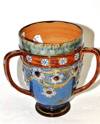 Lot 188 - A Royal Doulton Lambeth stoneware tyg, by Ethel Beard, 19cm