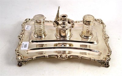 Lot 189 - An Elkinton plate encrier with chamberstick and two silver topped glass bottles