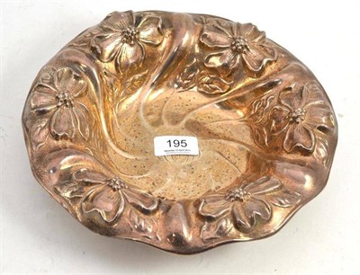 Lot 195 - An Art Nouveau sterling silver dish with repousse decoration