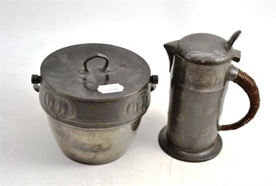 Lot 199 - An English pewter biscuit barrel and small jug after Archibald Knox