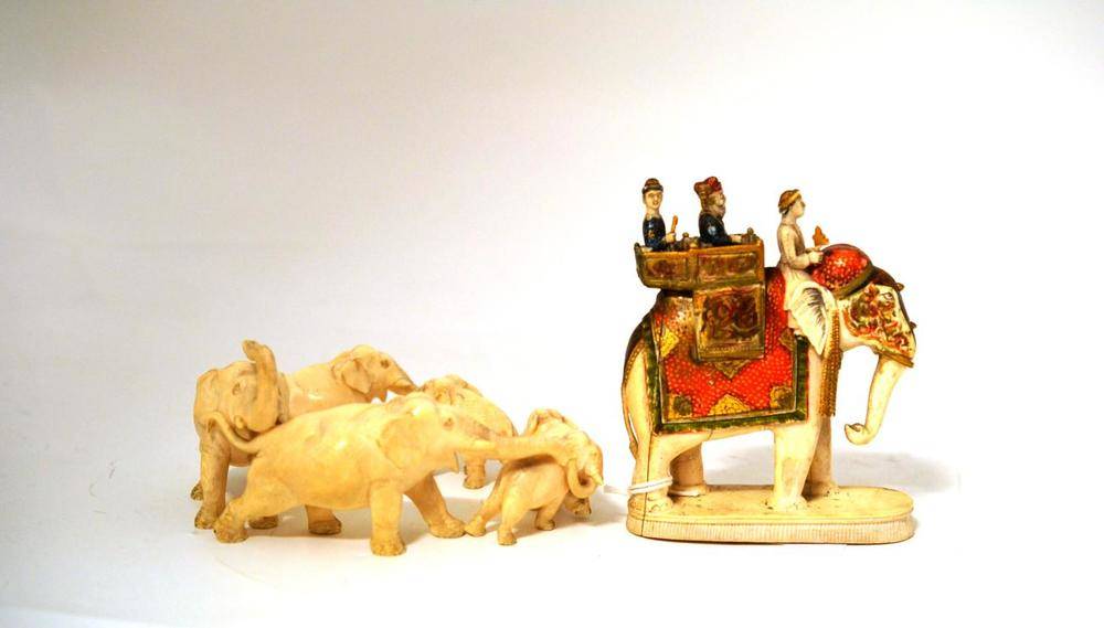 Lot 158 - An Indian Carved Elephant Ivory Ring of Six Elephants, circa 1910, the largest elephant with...
