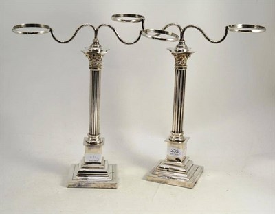 Lot 235 - A pair of plated Corinthian column crick light stands