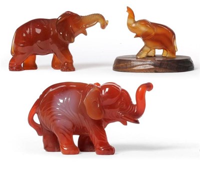 Lot 160 - A Chinese Carved Chalcedony Elephant, late Qing Dynasty, the standing beast with upraised trunk and