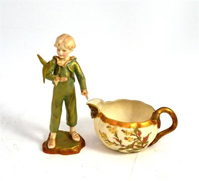 Lot 257 - A Worcester figure of a parakeet and a blush ivory Worcester jug (2)