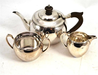 Lot 264 - A three piece tea set