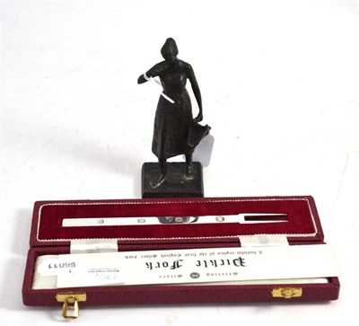 Lot 270 - Small bronze sculpture of a Dutch girl 'Vera '64', signed Kon Deoeer Voorschoten and a cased silver