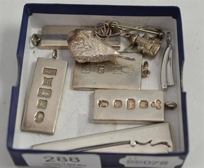 Lot 288 - Four silver ingot pendants, a free-form pendant, a folding knife, an Art Nouveau brooch, a...