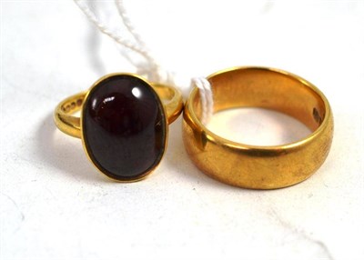 Lot 292 - Two 18ct gold rings, one with a carbuncle garnet inset