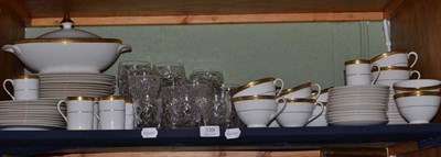 Lot 339 - A shelf containing a part twelve setting Royal Doulton Royal Gold H.4980 dinner service and a...