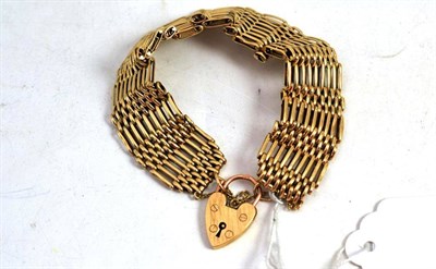 Lot 403 - A gold nine bar gate bracelet