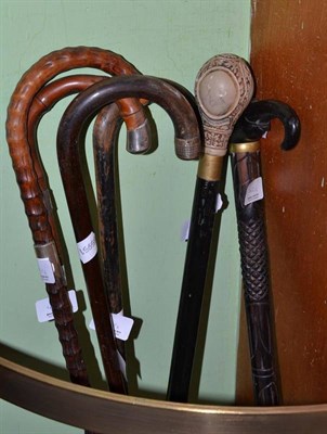 Lot 412 - Three silver mounted walking sticks, an Indian ebony walking stick with elephant head handle...