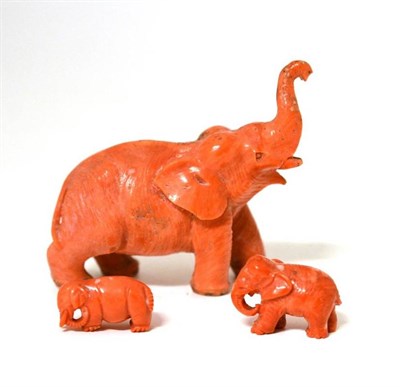 Lot 173 - A Chinese Carved Red Coral Standing Figure of an Elephant, late 19th century, in trumpeting...