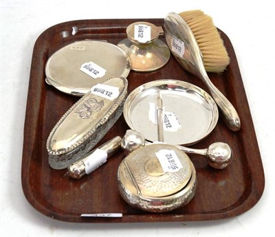 Lot 437 - A silver inkwell, rattle, snuff box, dish, dressing table brush, compact, cheroot holder, glass box