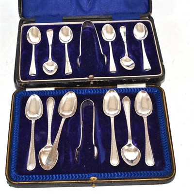 Lot 438 - Two sets of silver teaspoons and tongs, cased