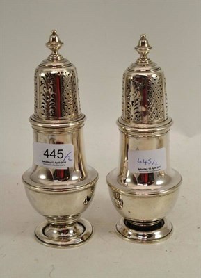 Lot 445 - A pair of silver sugar castors (one foot deformed)