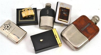 Lot 464 - Two pewter spirit flasks, a Colibri lighter, a hand warmer, a cigarette case and an atomizer