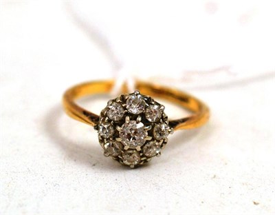 Lot 490 - A diamond cluster ring stamped '18'