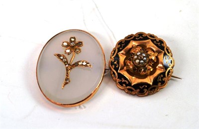 Lot 511 - A chalcedony brooch with diamond set floral motif and a Victorian pearl brooch with black enamel