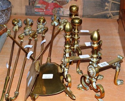 Lot 516 - Two pairs of brass andirons and two brass companion sets with ball and claw finials