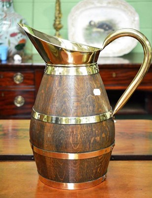 Lot 519 - Wood and brass jug