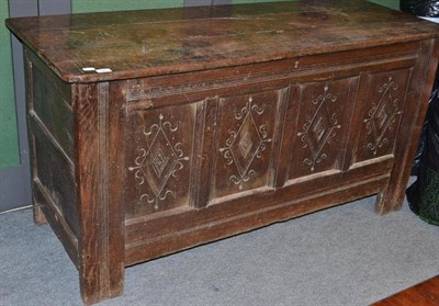 Lot 525 - A 17th century oak coffer with carved panels, 153cm wide, 78cm high