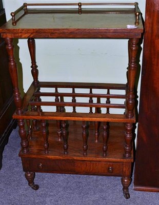 Lot 527 - A Victorian walnut Canterbury with shelf above, 88cm high