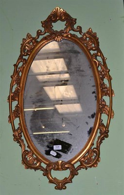 Lot 528 - An reproduction gilt framed oval wall mirror