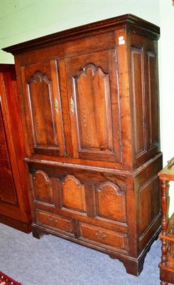 Lot 529 - An 18th century panelled oak livery cupboard, 176cm high