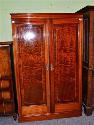 Lot 530 - An American mahogany wardrobe with patented pull-out hanging space, Innovation Trunk Co., 163cm...