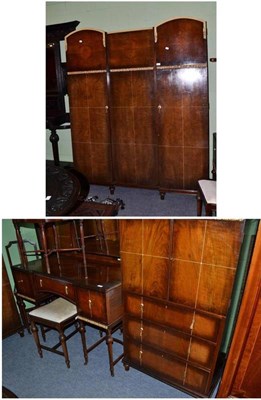 Lot 531 - A 1930's bedroom suite comprising triple wardrobe, two beds, chest, dressing table and stool