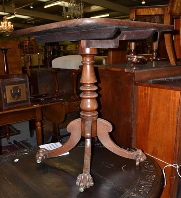 Lot 541 - A George III mahogany tilt top table on turned column and paw feet