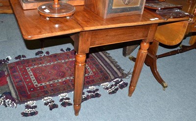 Lot 552 - A mahogany drop-leaf dining table