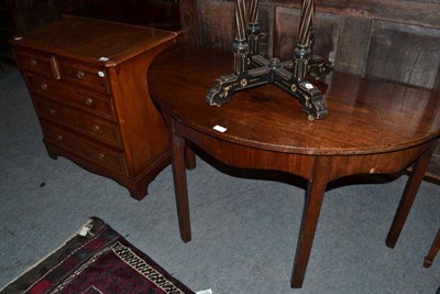 Lot 558 - A reproduction four height chest of drawers and a demi lune table