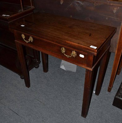 Lot 567 - A 19th century mahogany fold over tea table