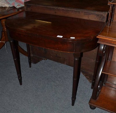 Lot 569 - A Georgian D-shaped mahogany fold-over tea table, 91cm wide