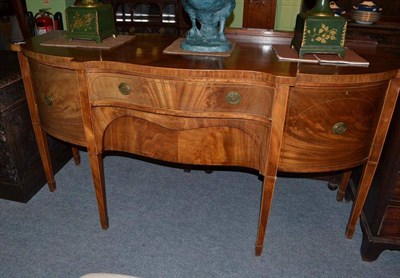 Lot 572 - A 19th century mahogany sideboard with shaped front, two drawers and two cupboards raised on...