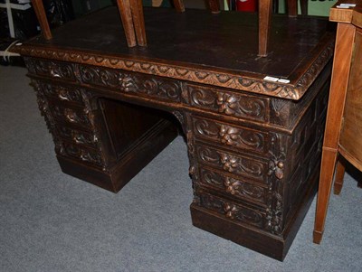 Lot 573 - A Victorian carved oak pedestal desk, 132cm wide