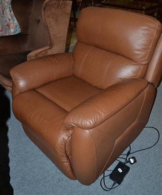 Lot 574 - A brown leather electric reclining armchair