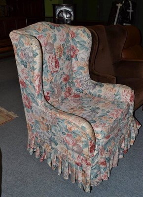 Lot 576 - A floral covered armchair