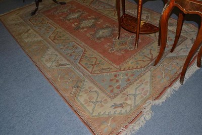 Lot 596 - Melas carpet, West Anatolia, the peach field with a row of diamond medallions enclosed by...