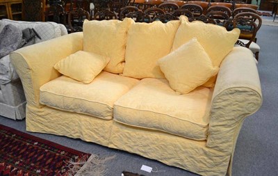 Lot 599 - Two seater yellow sofa