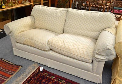 Lot 600 - A two seater cream upholstered settee