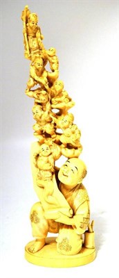 Lot 190 - A Japanese One Piece Carved Elephant Ivory  "Happy Gods " Group, late Meiji period, as an...