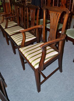 Lot 611 - A set of four George III style dining chairs with drop in seats