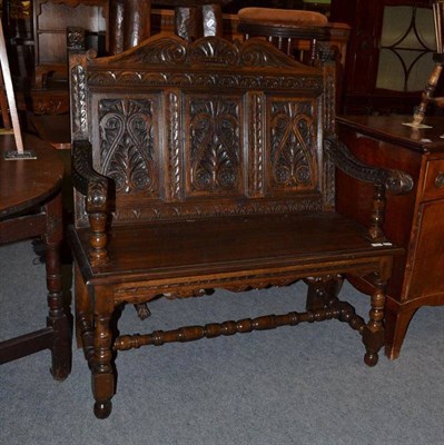 Lot 622 - A carved oak monk's bench