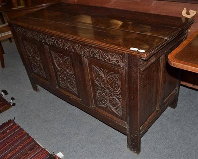 Lot 631 - An 18th century panelled oak kist, possibly later carved, 133cm wide