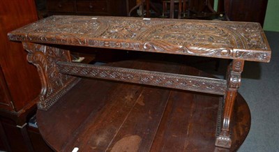 Lot 633 - A Victorian oak hall bench profusely carved in low relief, dated 1892, 117cm wide