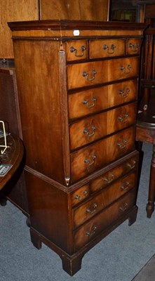 Lot 653 - A reproduction diminutive chest on chest in a George III style, 126cm high, 60cm wide, 35cm deep